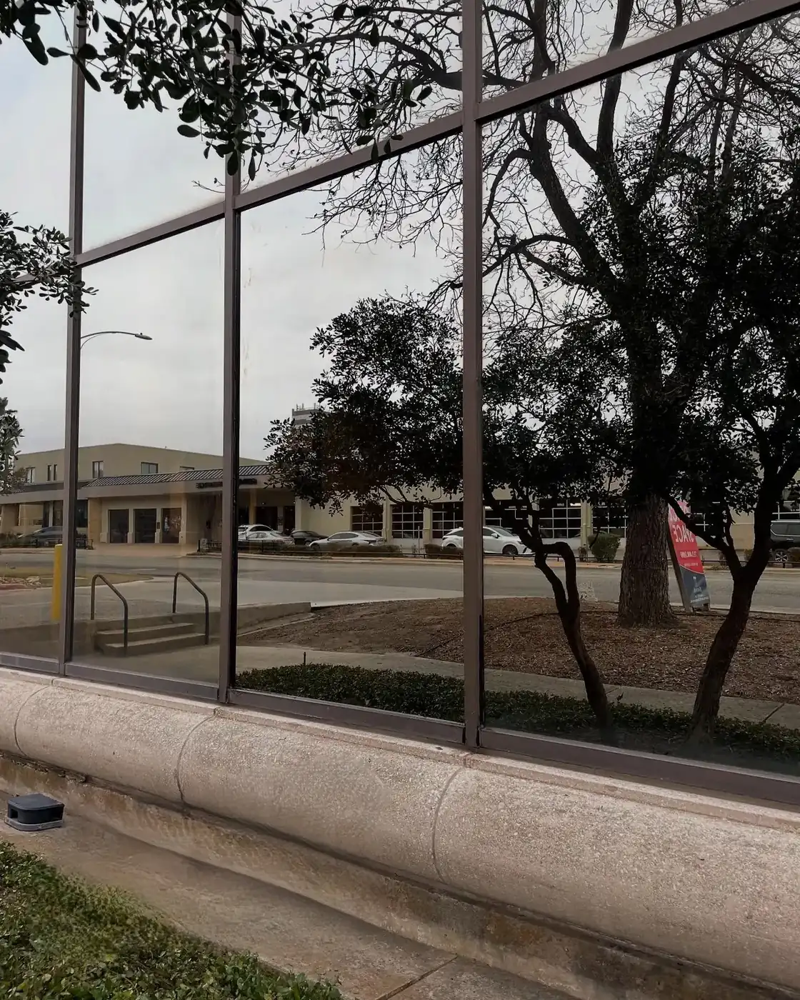 Replacement glass set in a storefront window line