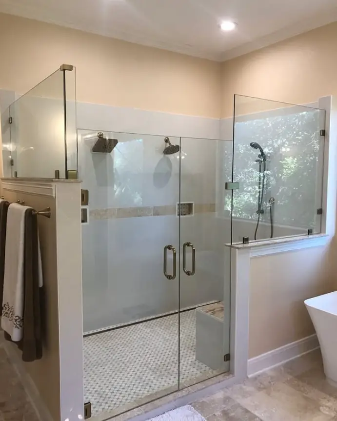 Frameless shower door and return panel