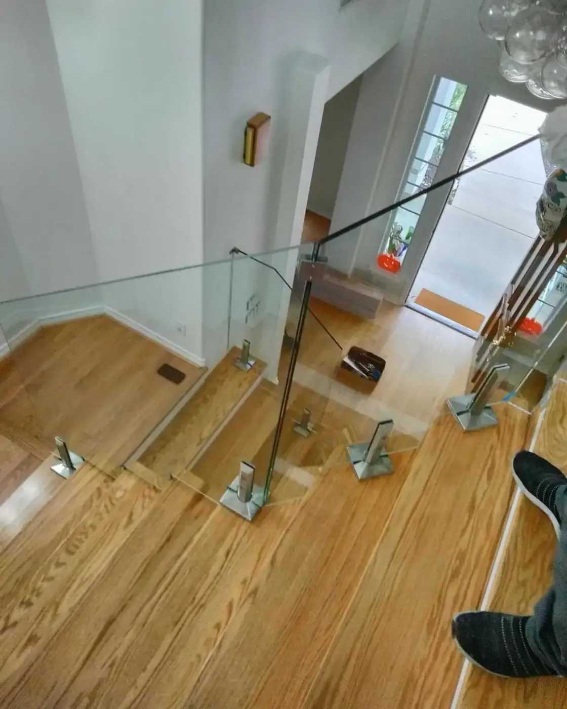 Frameless glass railing at the landing